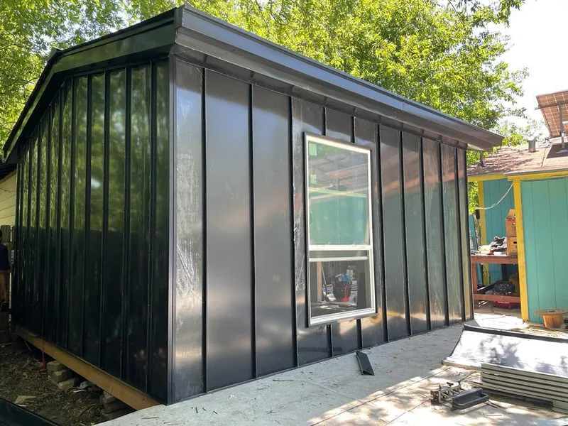 Black standing seam metal wall panels for Metal Roof Installation in Ripley