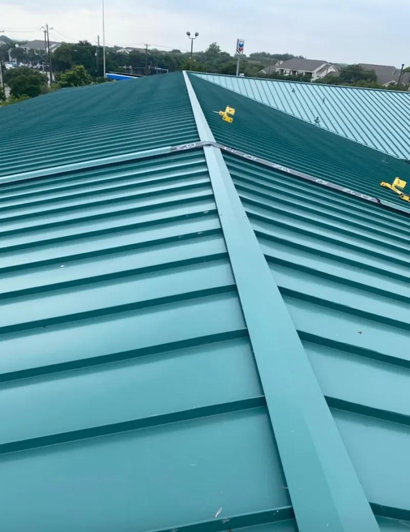 Green commercial metal roof ridge and valley for Metal Roof Repair in Ripley